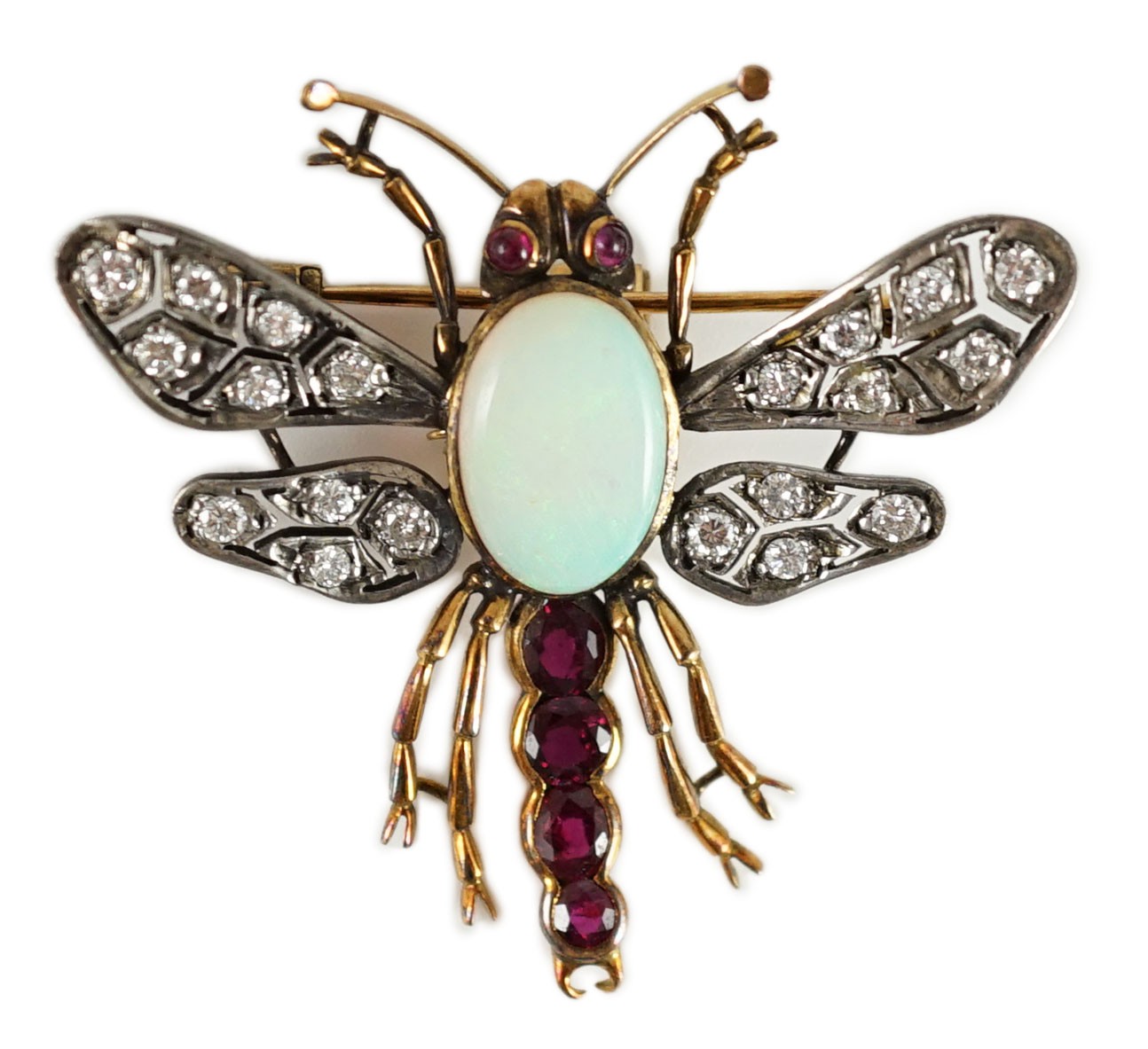 An early 20th century gold and silver, white opal, ruby and diamond set bug brooch